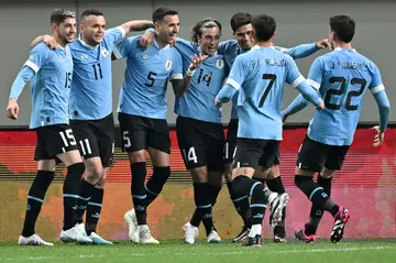 Uruguay's Matias Vecino Falero (3rd L) celebrates his goal against South Korea