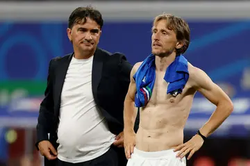 Luka Modric (R) and Croatia coach Zlatko Dalic (L) look on after Italy scored a last-gasp equaliser at Euro 2024