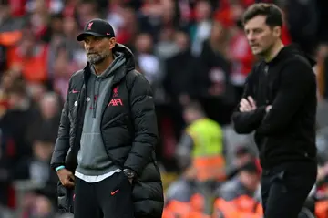 Jurgen Klopp (left) watches his Liverpool players against Tottenham