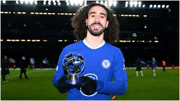 Marc Cucurella poses for a photograph with the PlayStation Player of the Match award at Stamford Bridge. Photo by Darren Walsh.