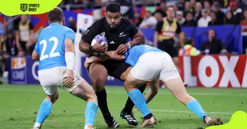 New Zealand's Samisoni Taukei'aho (in black) in action.