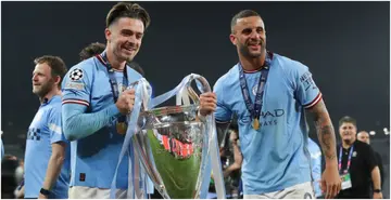 Jack Grealish and Kyle Walker lift the trophy after the UEFA Champions League 2022/23 final match between Inter and Manchester City. Photo by James Gill.