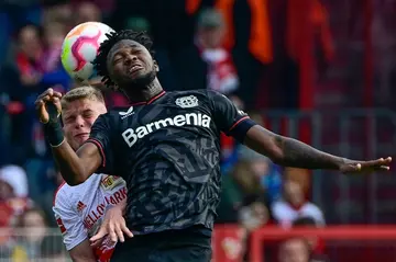 Heads up: Leverkusen defender Edmond Tapsoba and Union Berlin midfielder Andras Schaefer challenge for the ball