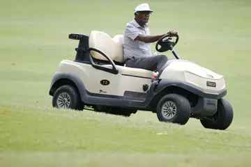 Vijay Singh drives a cart