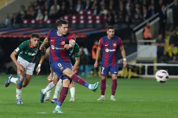 Barcelona's Polish forward Robert Lewandowski struck from the spot to net a brace and win his team the game against Alaves
