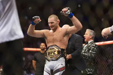 Sean Stickland is presented with the Middleweight title.