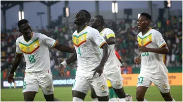 Abdoulaye Seck celebrates with teammates during the TotalEnergies CAF Africa Cup of Nations group stage match between Guinea and Senegal. Photo by MB Media.