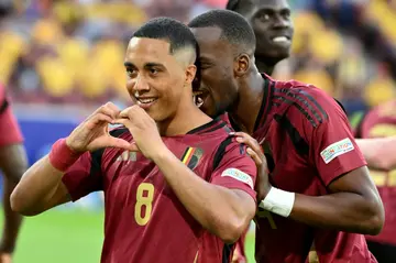 Belgium midfielder Youri Tielemans (L) celebrates after scoring against Romania