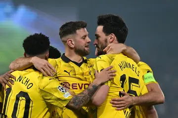Mats Hummels (R) celebrates with teammates after heading Borussia Dortmund in front on the night