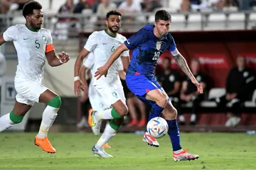 US forward Christian Pulisic (right) is challenged by Saudi Arabia defender Ali al-Bulaihi (left) Tuesday's friendly in Murcia