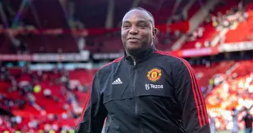 Manchester United's Benni McCarthy smiling at Old Trafford.