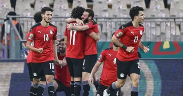 Egypt's players celebrate their second goal during the Africa Cup of Nations (CAN) 2021 quarter-final football match between against Morocco (Photo by Kenzo Tribouillard / AFP).