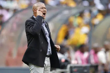Cavin Johnson shouts instructions to his players from the touchline during the DStv Premiership football match between Kaizer Chiefs and Orlando Pirates at the FNB Stadium. Photo: Phill Magakoe.
