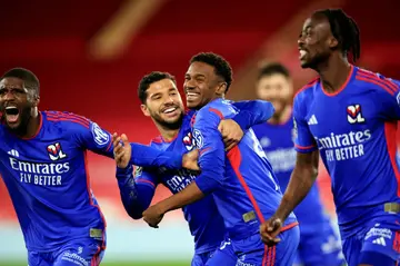 Lyon's Jeffinho (C) celebrates with teammates after scoring the winner against Monaco