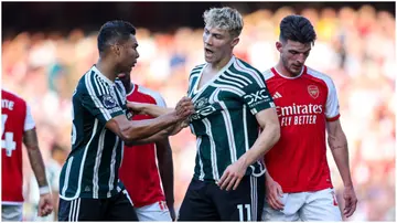 Casemiro welcomes team-mate Rasmus Hojlund of Manchester United onto the pitch during the Premier League match between Arsenal FC and Manchester United at Emirates Stadium. Photo by Robin Jones.