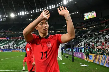 South Korea's  Hwang Hee-chan applauds the fans at the end of the game