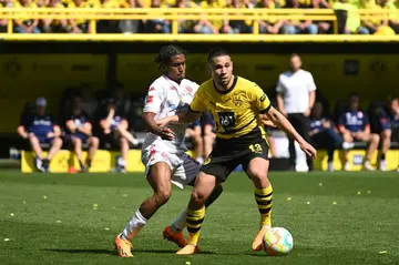 Portuguese defender Raphael Guerreiro (C) has signed with Bayern Munich after seven years with Borussia Dortmund