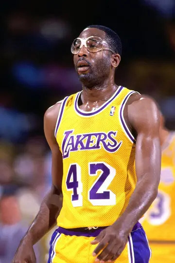 Who was the basketball player with thick glasses?