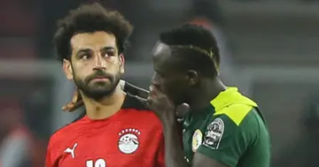Senegal's Sadio Mane (L) consoles Egypt's Mohamed Salah (R) at the end of the Africa Cup of Nations (CAN) 2021 final in Yaounde, Cameroon (Photo by Adam Haneen/Anadolu Agency via Getty Images)