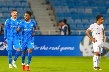 Al Hilal's Saudi midfielder Salem al-Dawsari (2nd-L) celebrates his goal