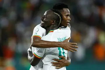 Habib Diallo (L) is hugged by Sadio Mane after scoring the second Senegal goal against Cameroon.