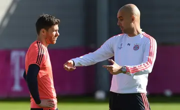 Xabi Alonso (left) played under Pep Guardiola among a number of top coaches