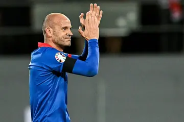 Andorra captain Ildefons Lima returns the applause as he walks of an international pitch for the last time in Sion, Switzerland