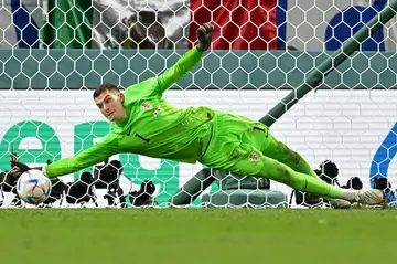 Croatia and Dinamo Zagreb goalkeeper Dominik Livakovic saves a penalty during the penalty shootout win against Japan