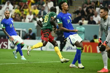 Vincent Aboubakar (C) scores Cameroon's late winner against Brazil