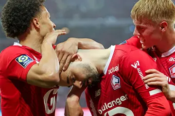 Edon Zhegrova (C) celebrates with teammates after scoring Lille's second goal at home to Lyon, but it was the away side who ran out 4-3 winners