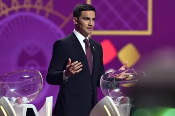 Tim Cahill on stage during the draw for the 2022 World Cup in Qatar