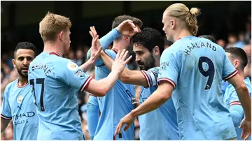 Ilkay Guendogan celebrates with Kevin De Bruyne and Erling Haaland after scoring during the Premier League match between Manchester City and Leeds United at Etihad Stadium. Photo by Gareth Copley.