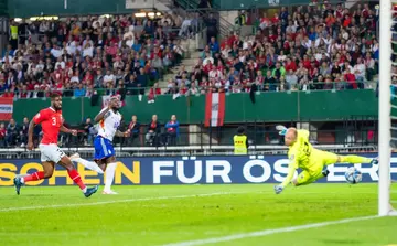 Romelu Lukaku (C) hits Belgium's tyhird past  Austria goalkeeper Alexander Schlager