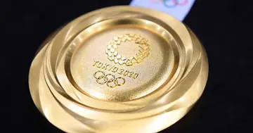 The gold medal is displayed after the Tokyo 2020 medal design unveiling ceremony at Tokyo International Forum on July 24, 2019 in Tokyo, Japan. (Photo by Atsushi Tomura/Getty Images).