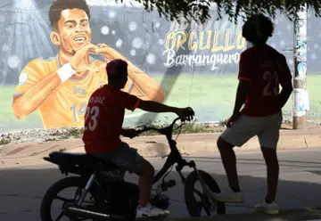 The mother of Colombian footballer Luis Diaz, who plays for Liverpool of England, was rescued on October 28, 2023, after the authorities reported the kidnapping of his parents in the department of Guajira (north), said President Gustavo Petro. (FILES) Fans of England's Liverpool football star Colombian Luis Diaz look at a mural depicting him, in Barrancas, Guajira province, Colombia, on May 22, 2022.