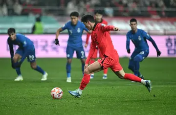 South Korea's forward Hwang Ui-jo scores a penalty against Singapore earlier this month