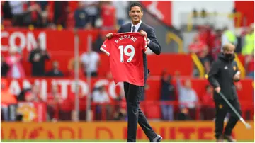 Raphael Varane is introduced to fans on the pitch prior to the Premier League match between Manchester United and Leeds United at Old Trafford. Photo by Catherine Ivill.