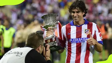 Atletico Madrid's Tiago Mendes celebrates after winning Super Cup in 2014