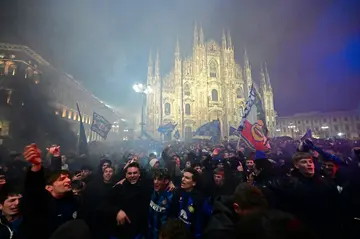 Inter Milan's supporters celebrate winning the 2024 Scudetto championship title at the Piazza del Duomo in central Milan, on April 22, 2024, after Inter Milan won the Italian Serie A football match against AC Milan.