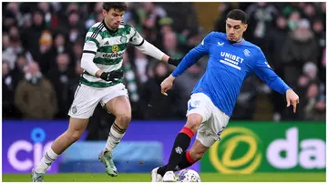 Injured Rangers star, Leon Balogun, defends against Celtic's Matt O'Riley during the Scottish Premiership match at Celtic Park on December 30, 2023, in Glasgow.