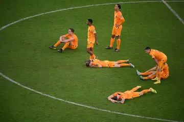 Netherlands players react after their defeat to Argentina in the World Cup quarter-finals