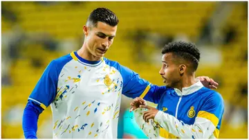 Cristiano Ronaldo and Abdullah Ghareeb in discussion after the veteran gave his teammate a chance from the penalty spot.