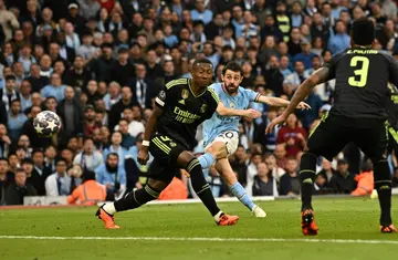 Manchester City's Bernardo Silva (C) scores against Real Madrid