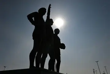 A statue of Manchester United's 'Holy Trinity' of George Best, Bobby Charlton and Denis Law outside Old Trafford