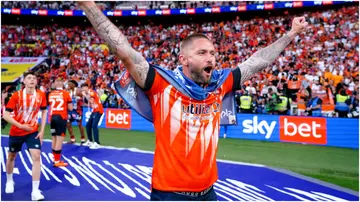 Henri Lansbury celebrates at the end of the Sky Bet Championship play-off final at Wembley Stadium. Photo by Zac Goodwin.