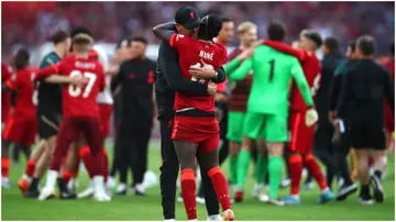 Jurgen Klopp celebrates his team's victory with Sadio Mane during the FA Cup Final match between Chelsea and Liverpool at Wembley Stadium. Photo by Chris Brunskill.