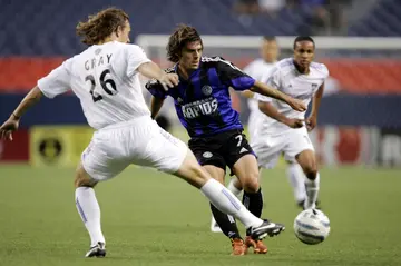 Luchi Gonzalez, in center driving the ball against San Jose during his days as a player, was named coach of Major League Soccer's San Jose Earthquakes, taking over after he completes his duties as an US national team assistant coach at the FIFA World Cup