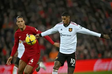 Marcus Rashford (right) denied accusations Manchester United gave up during a 7-0 defeat to Liverpool