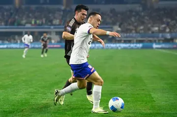 Sergino Dest of the United States blocks out Hirving Lozano of Mexico in the 2024 CONCACAF Nations League final between the USA and Mexico