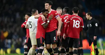 Harry Maguire of Manchester United celebrates with teammate Fred (L) after victory in the Premier League match between Leeds United and Manchester United at Elland Road on February 20, 2022 in Leeds, England. (Photo by Shaun Botterill/Getty Images)
